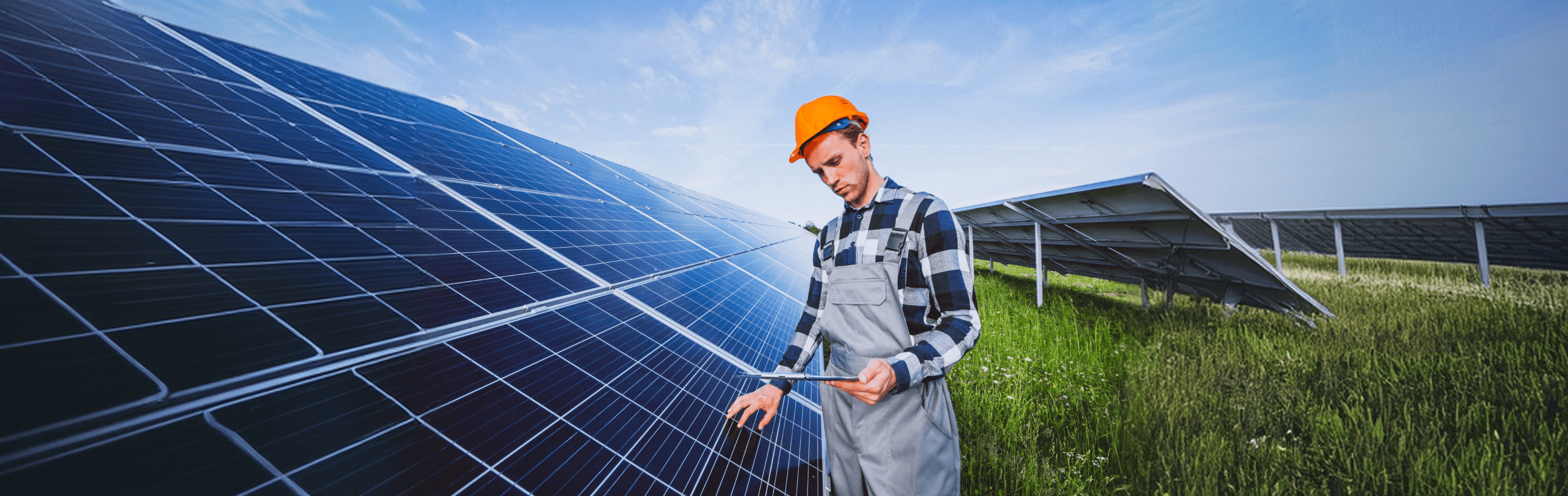 Solar technician inspecting rooftop panels